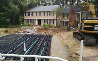 Bonica Excavation, Inc. Installing a septic system at a customers property.